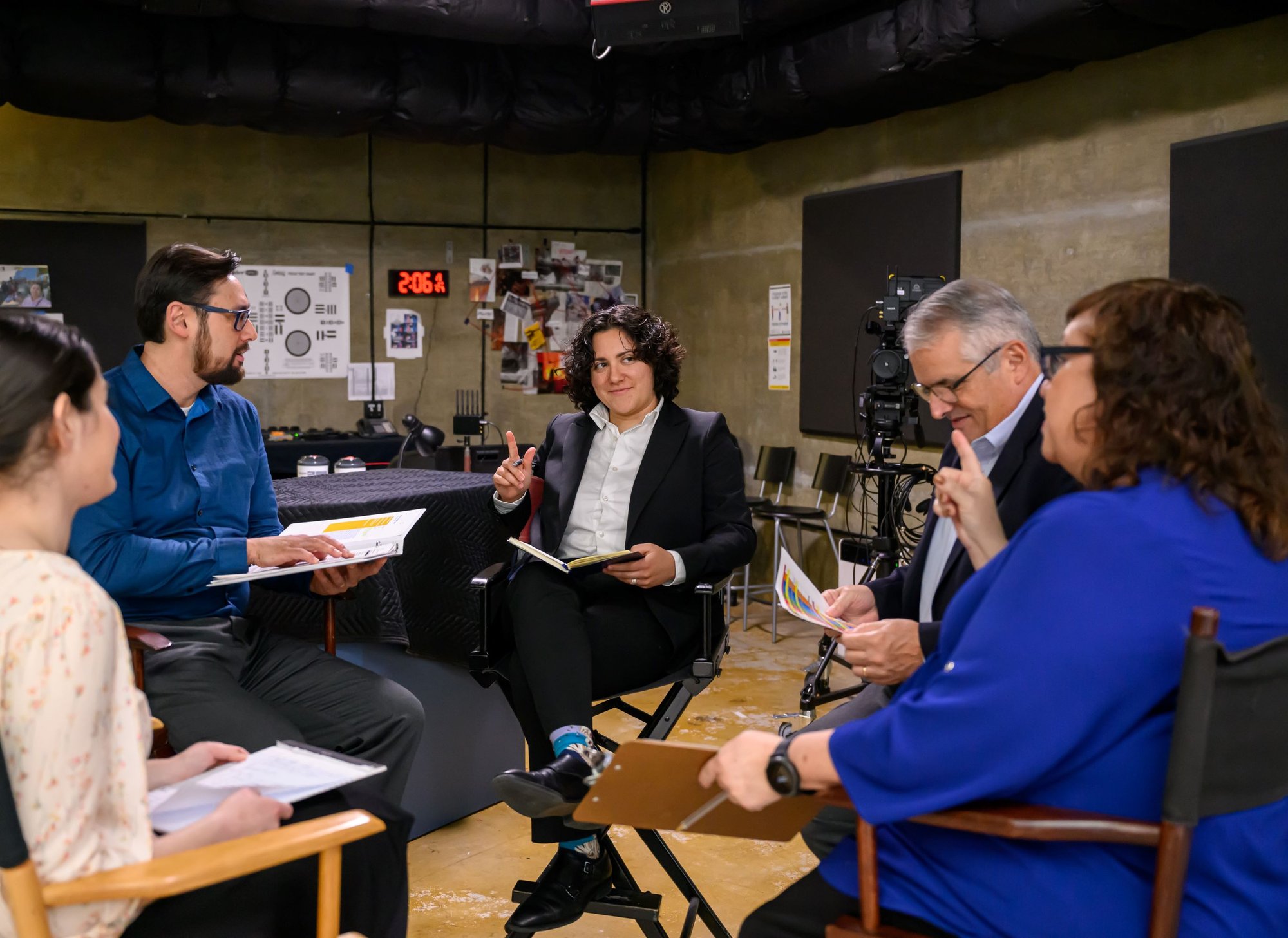 A group of Family Theater Productions staff in a creative meeting